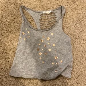 Never worn (no tags) tank top size small from Aeropostale. Grey with gold stars.